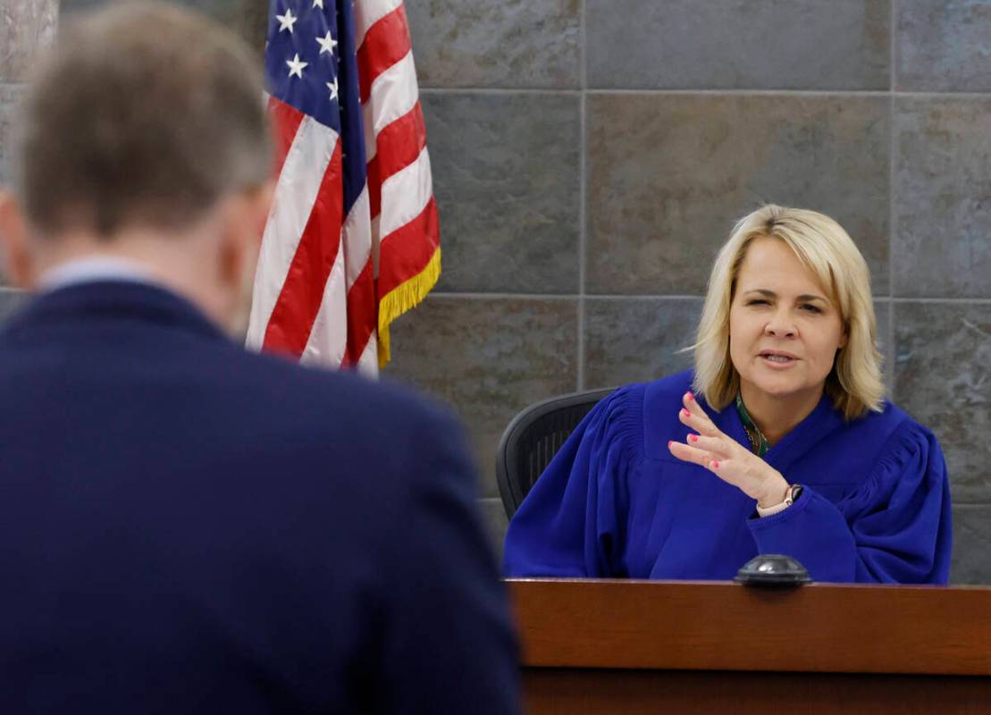 David Westbrook, left, a public defender, listens as Judge Amy JoAnne Chenini presides over Col ...