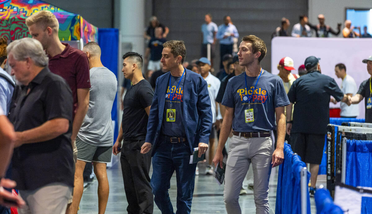 Attendees stream into the display space during the World Pickleball Convention within the Las V ...