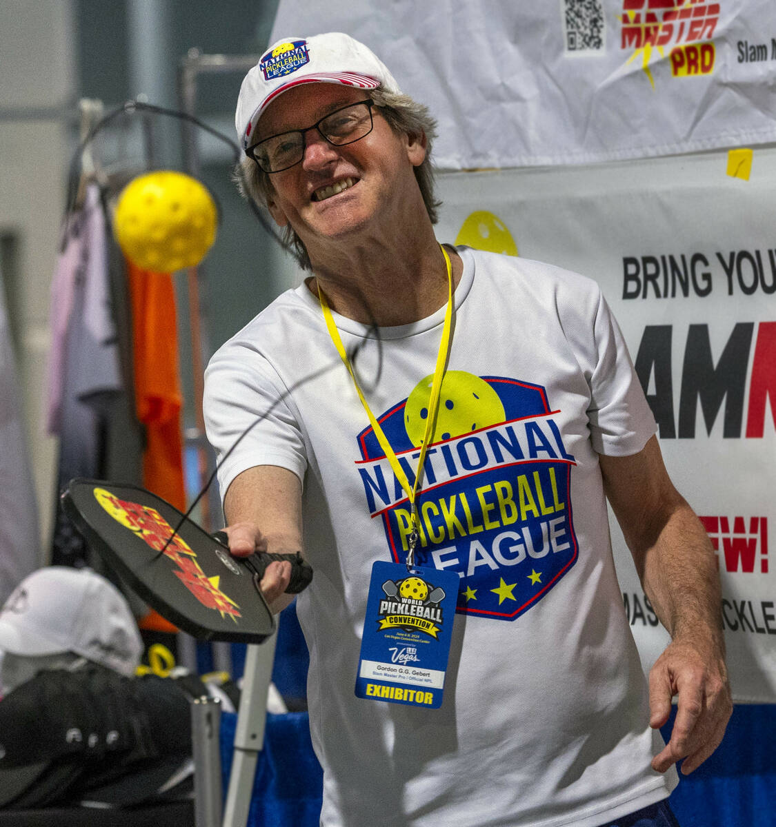 Gordon Gebert demonstrates his Slam Master Pro pickleball training paddle during the World Pick ...