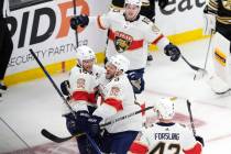 Florida Panthers' Aleksander Barkov (16) celebrates after his goal with Kyle Okposo (8), Gustav ...