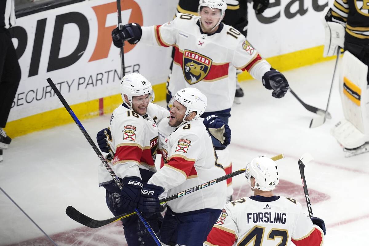 Florida Panthers' Aleksander Barkov (16) celebrates after his goal with Kyle Okposo (8), Gustav ...