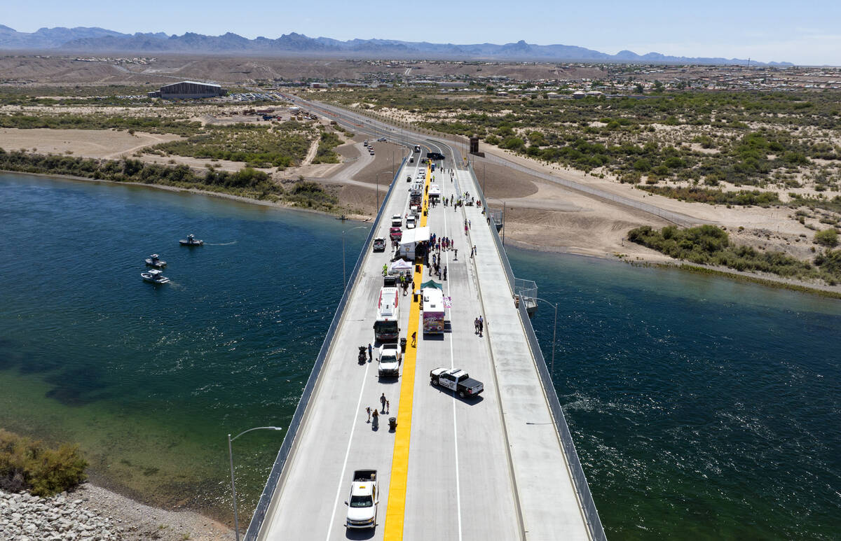 People walk on the bridge after a ribbon cutting ceremony for the opening of, officially named ...