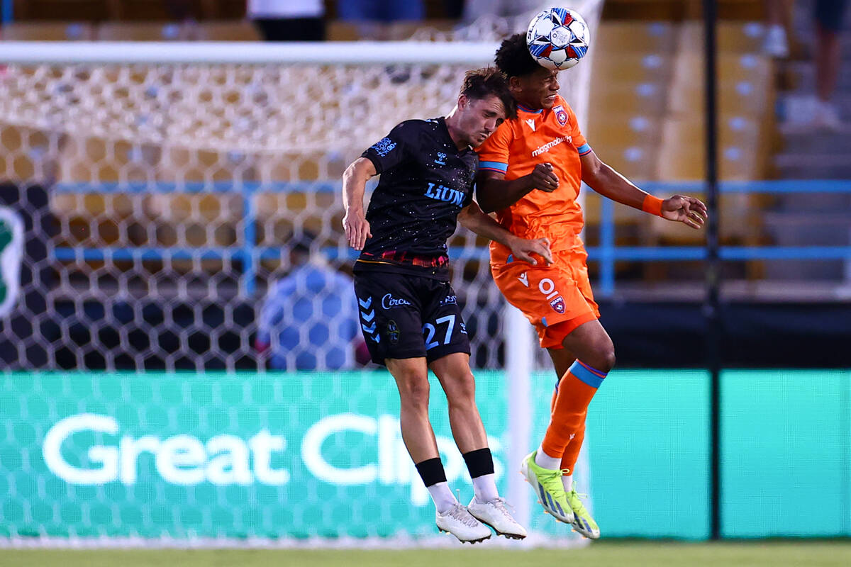 Miami FC defender Mujeeb Murana gets a header over Las Vegas Lights FC midfielder Valentin No&# ...