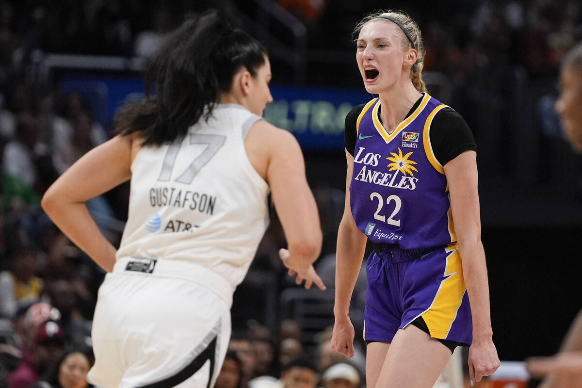 Los Angeles Sparks forward Cameron Brink (22) reacts near Las Vegas Aces center Megan Gustafson ...