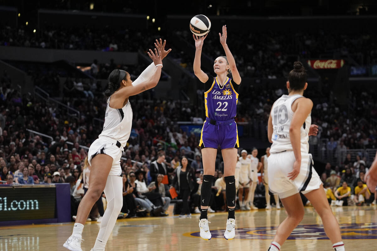 Los Angeles Sparks forward Cameron Brink (22) shoots against Las Vegas Aces center A'ja Wilson, ...
