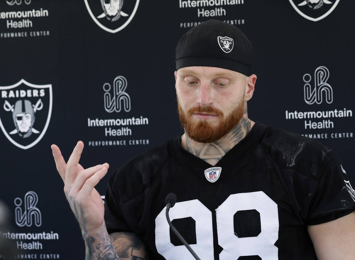 Raiders defensive end Maxx Crosby (98) pauses as he addresses the media after an NFL football p ...