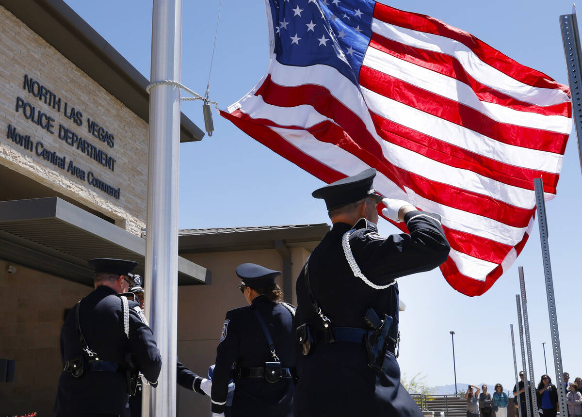 An American flag is raised during the official opening ceremony and ribbon cutting for the comm ...
