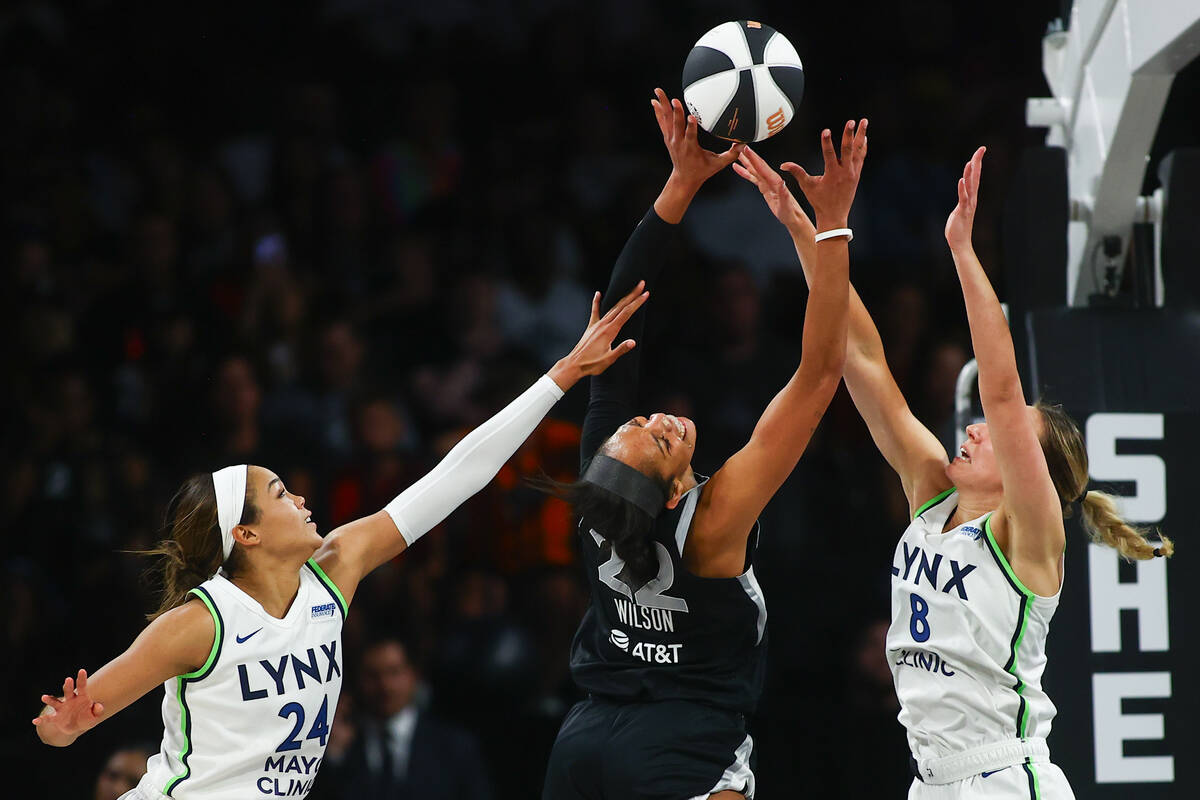 Las Vegas Aces center A'ja Wilson (22) shoots against Minnesota Lynx forward Napheesa Collier ( ...