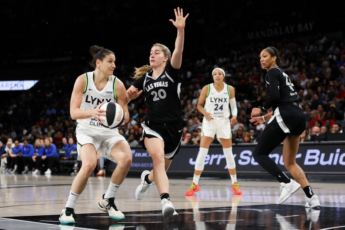 Minnesota Lynx forward Cecilia Zandalasini (9) drives toward the hoop while Las Vegas Aces guar ...