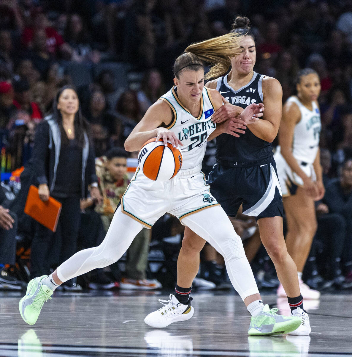 New York Liberty guard Sabrina Ionescu (20) fights off Aces guard Kelsey Plum (10) during the s ...