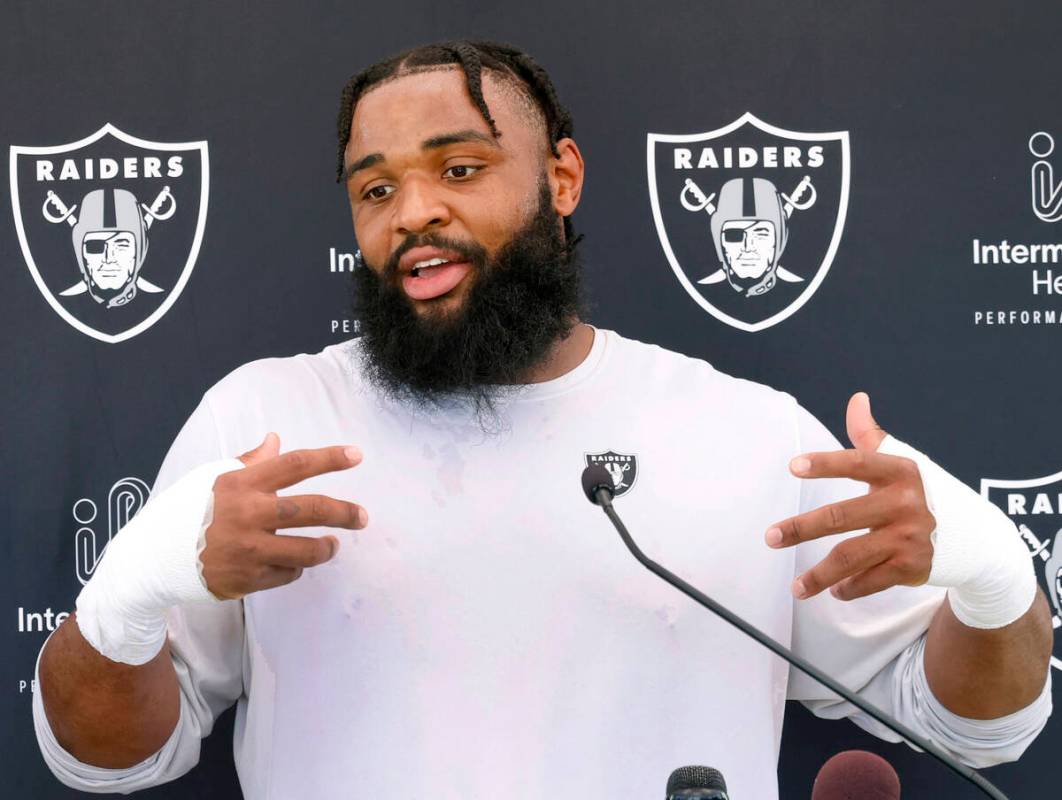 Raiders defensive tackle Christian Wilkins addresses the media after an NFL football practice a ...