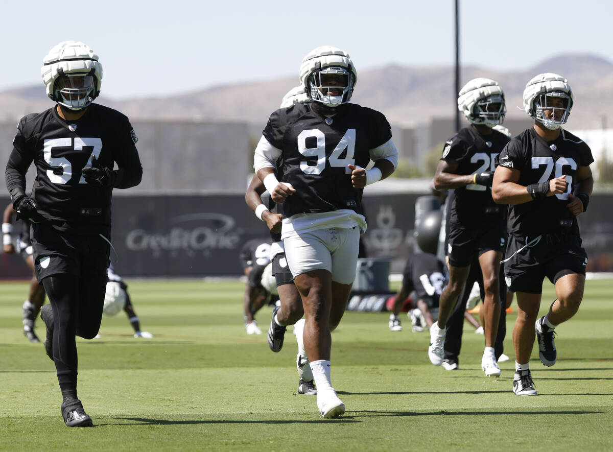 Raiders defensive tackle Christian Wilkins (94) warms up during an NFL football practice at the ...