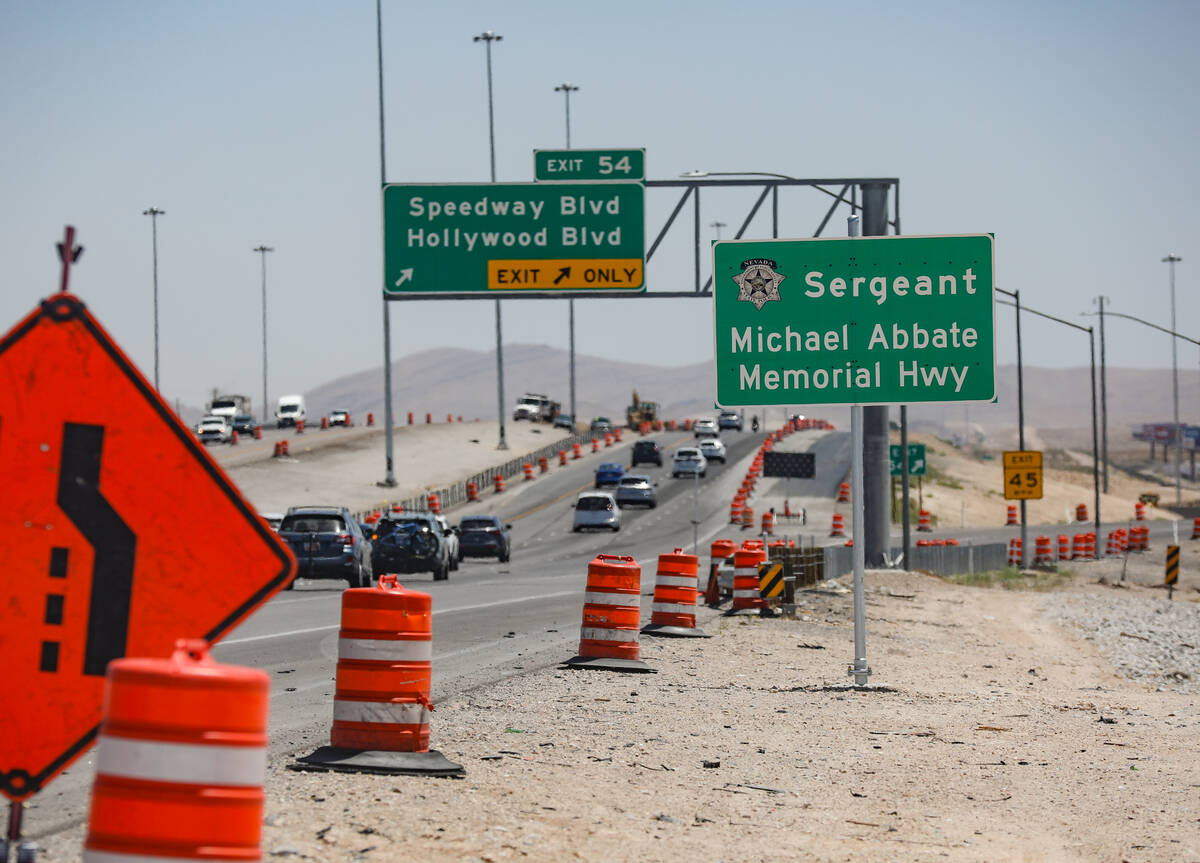 A memorial sign dedicated to Nevada Highway Patrol Sgt. Michael Abbate, who was killed along wi ...