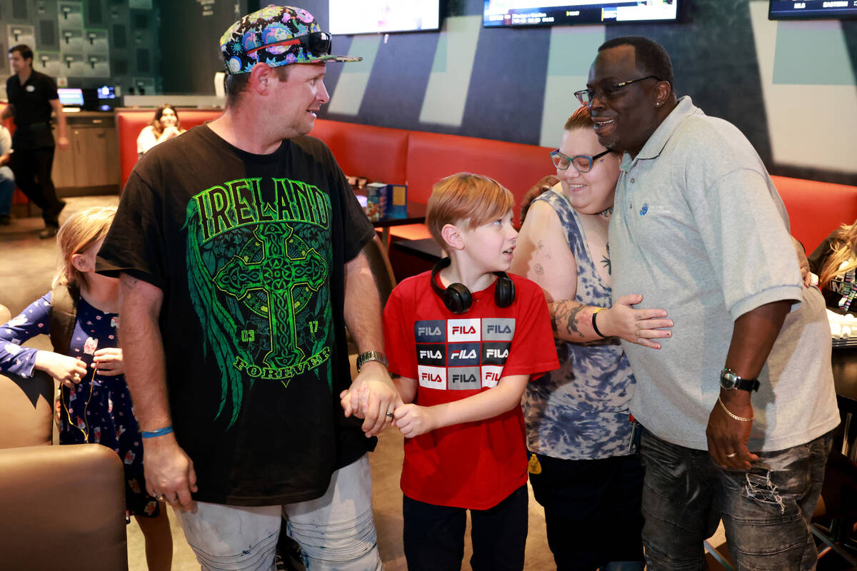 The recently reunified Melius family, from left, Zoey, 8, dad Bernard IV, mom Elizabeth and Vik ...