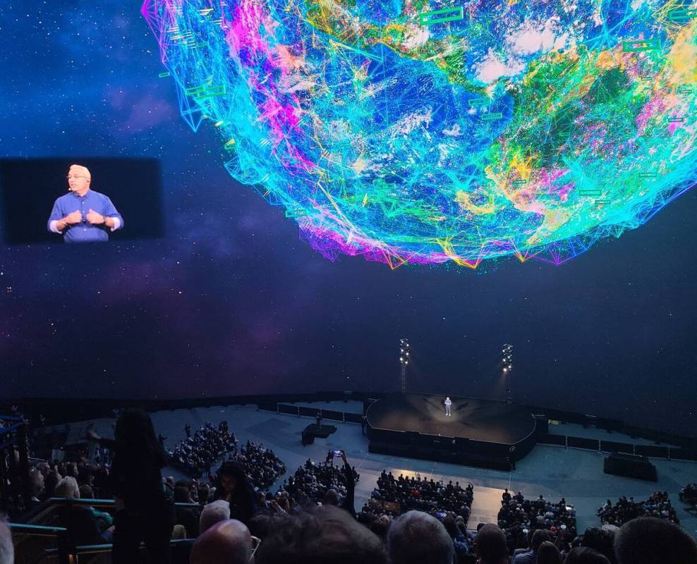 HPE CEO Antonio Neri onstage and in a picture-in-picture view at the Sphere Tuesday, June 18, 2 ...