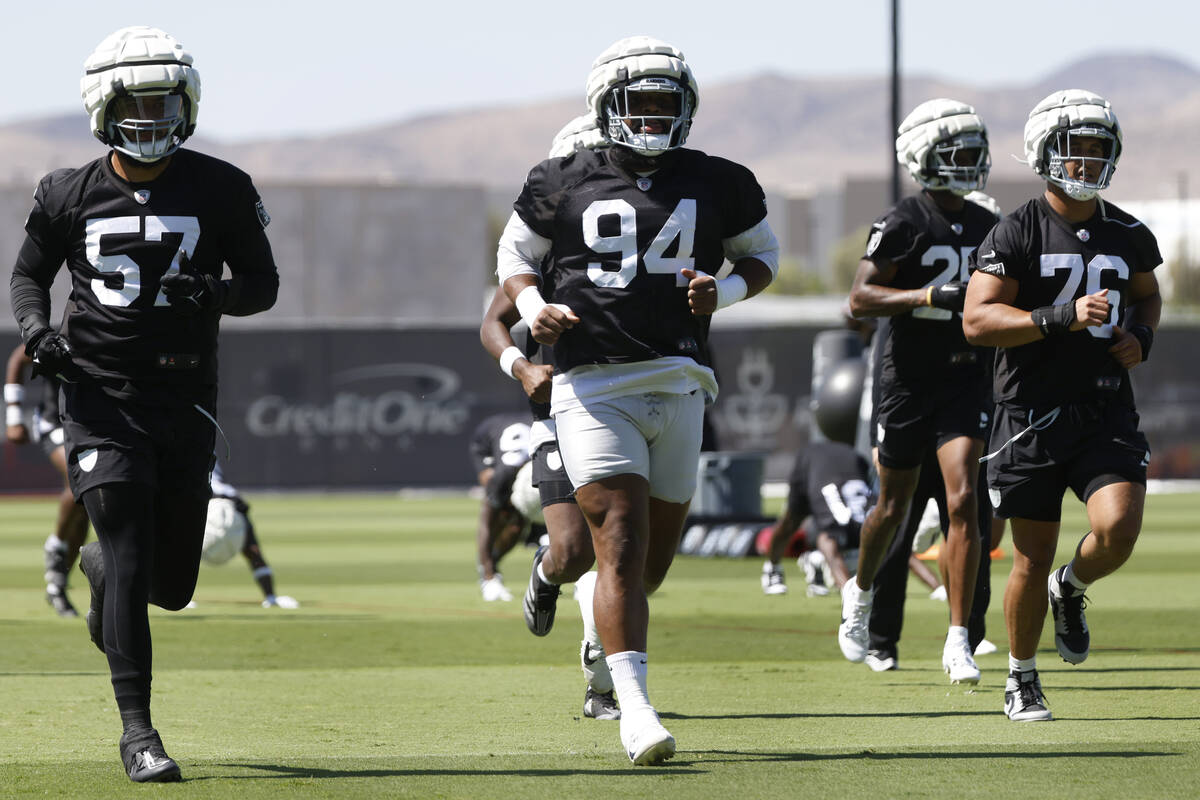 Raiders defensive tackle Christian Wilkins (94) warms up during an NFL football practice at the ...