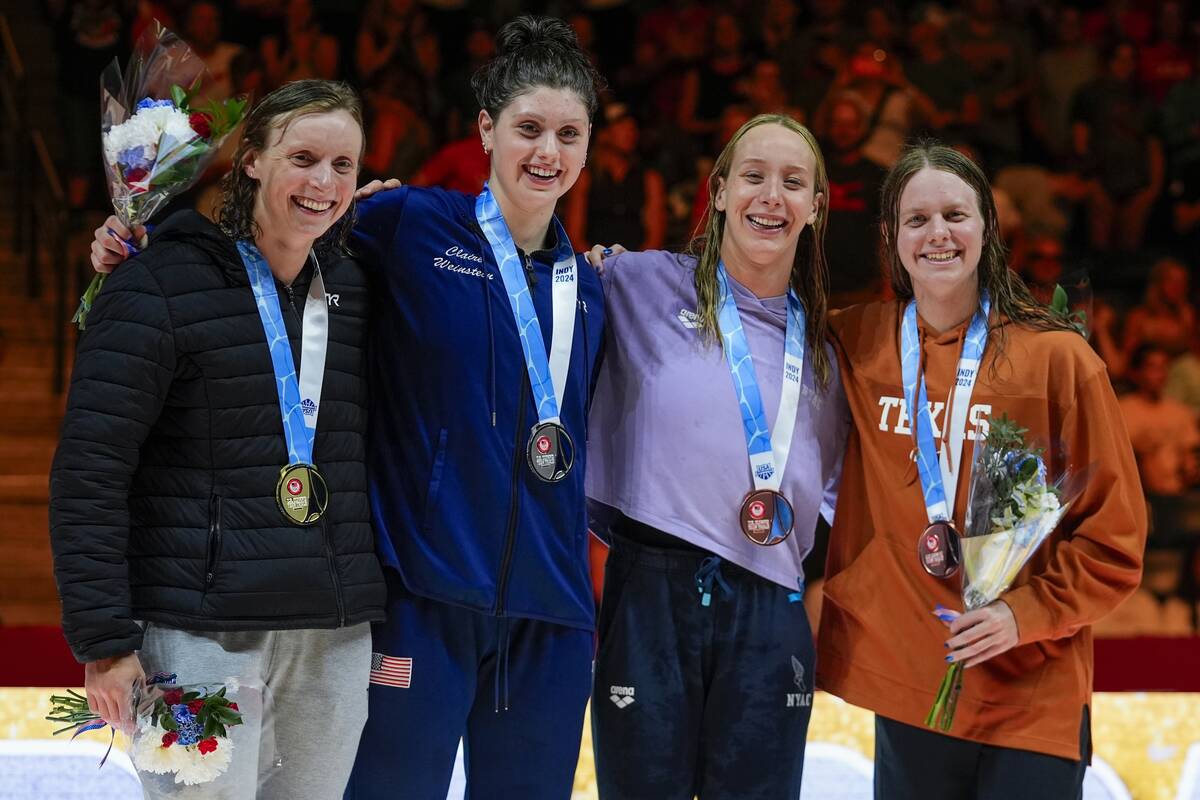 Katie Ledecky, Claire Weinstein, Paige Madden and Erin Gemmell celebrate after the Women's 200 ...