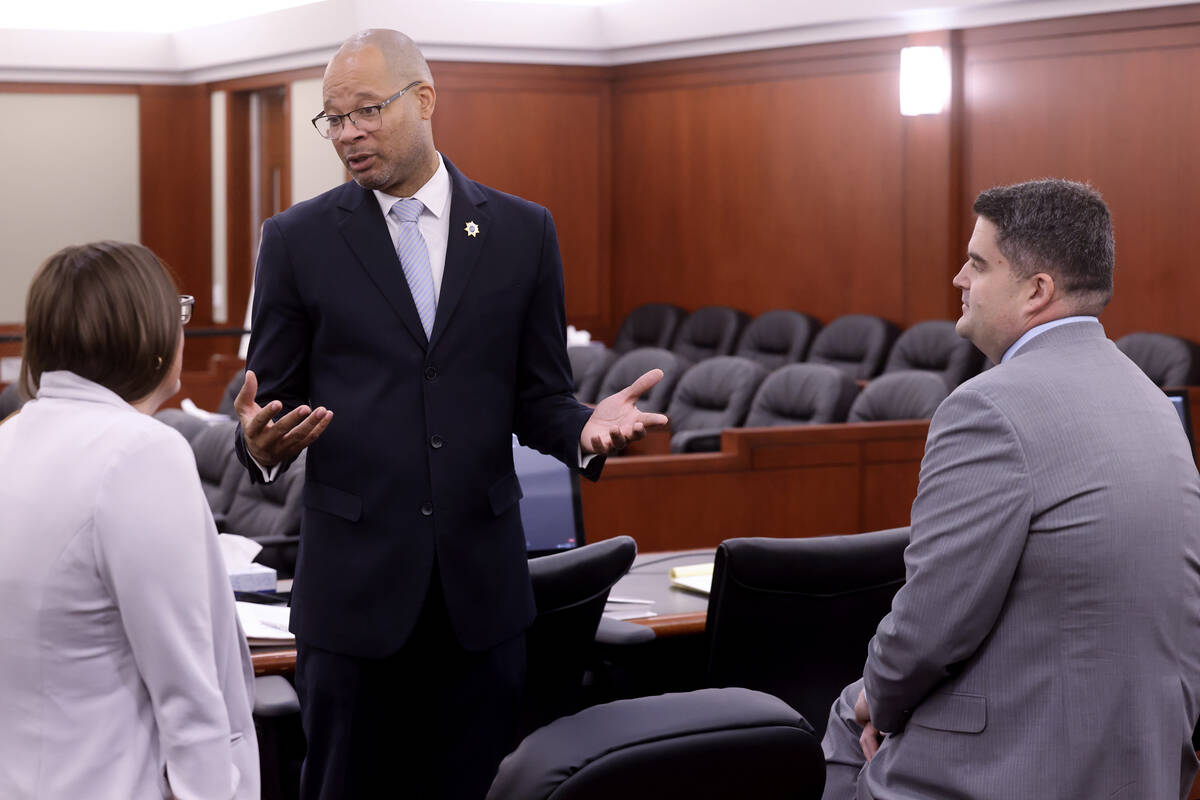 Attorney General Aaron Ford, left, meets with Chief Deputy Attorney General Alissa Engler, and ...