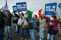 Attendees gather and sing before a car parade down the Las Vegas Strip to celebrate former Vice ...