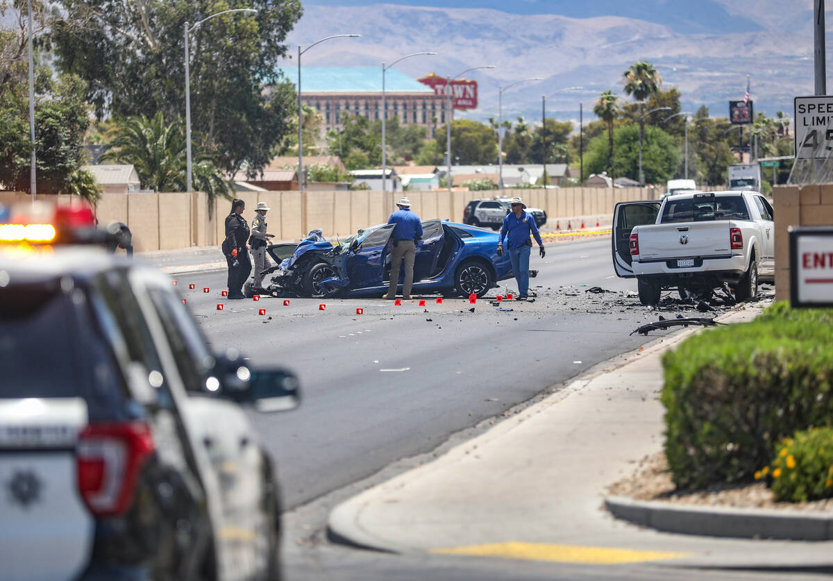 The Metropolitan Police Department investigates the scene of a fatal four vehicle crash on Sout ...