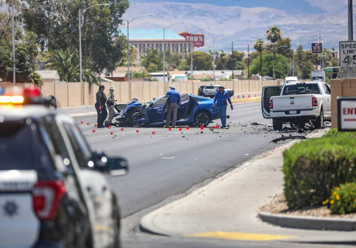 The Metropolitan Police Department investigates the scene of a fatal four vehicle crash on Sout ...