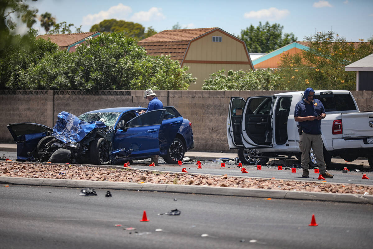 The Metropolitan Police Department investigates the scene of a fatal four vehicle crash on Sout ...