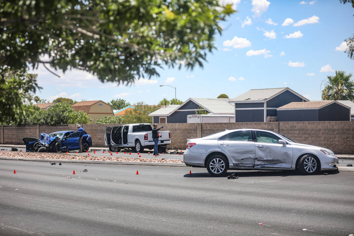 The Metropolitan Police Department investigates the scene of a fatal four vehicle crash on Sout ...