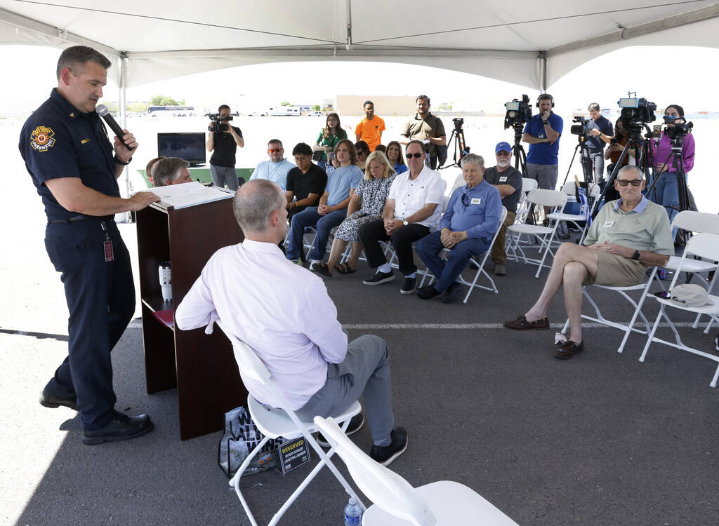 Brian O'Neal, assistant fire chief of the Clark County Fire Department, speaks as Justin Jones, ...