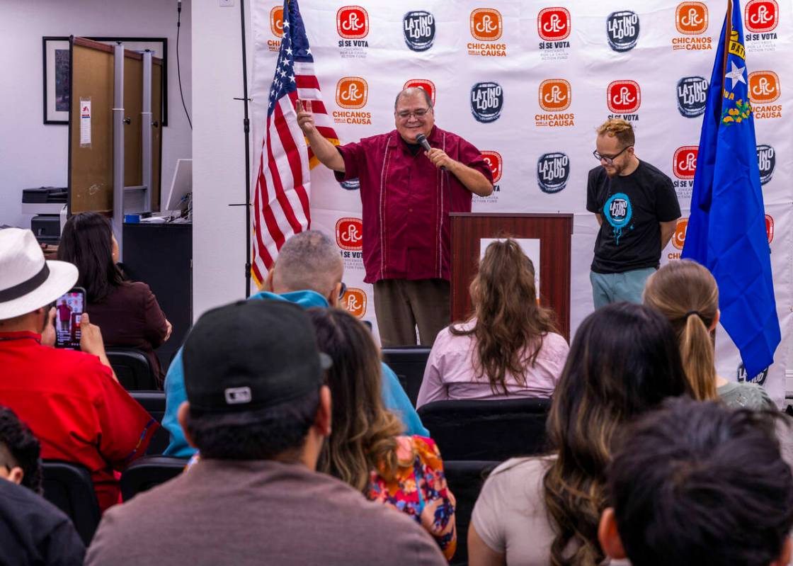 Joseph Garcia, left, adds one more point while speaking beside Rudy Zamora during the 2024 Lat ...