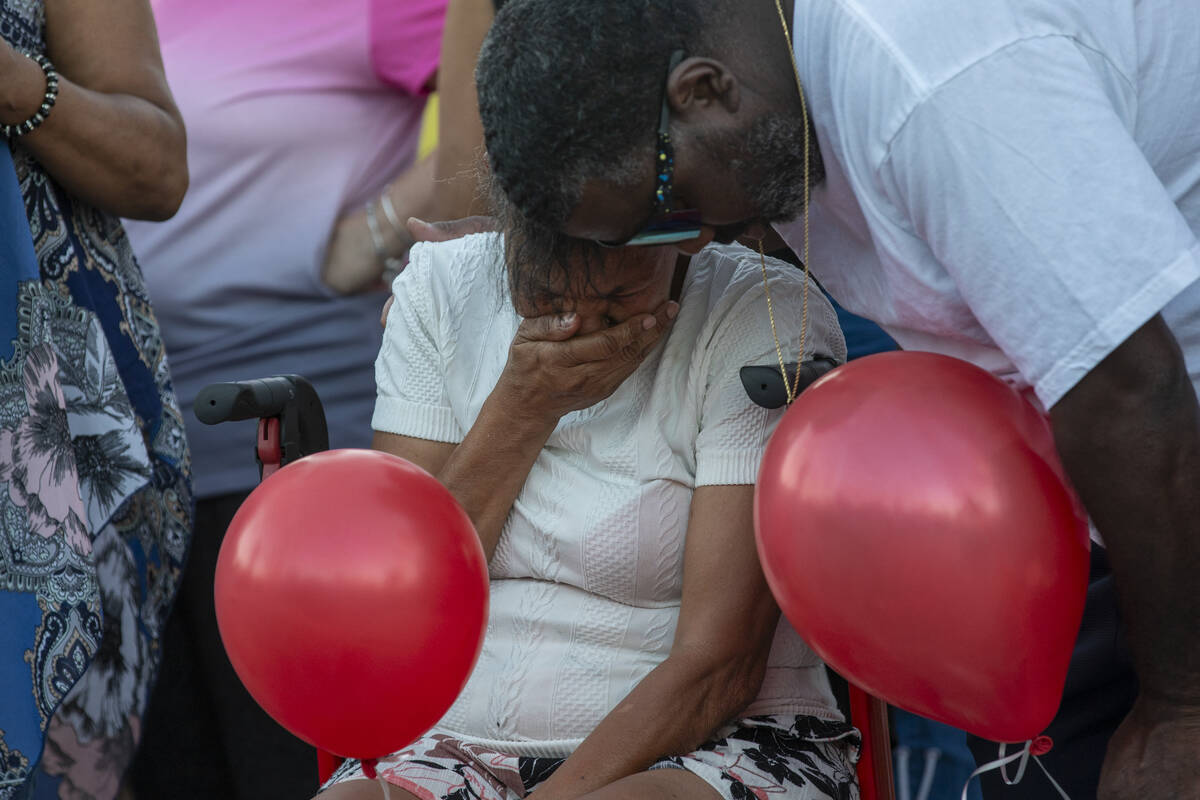 Kayla Harris’ grandmother mourns the loss of her granddaughter during a candlelight vigil at ...