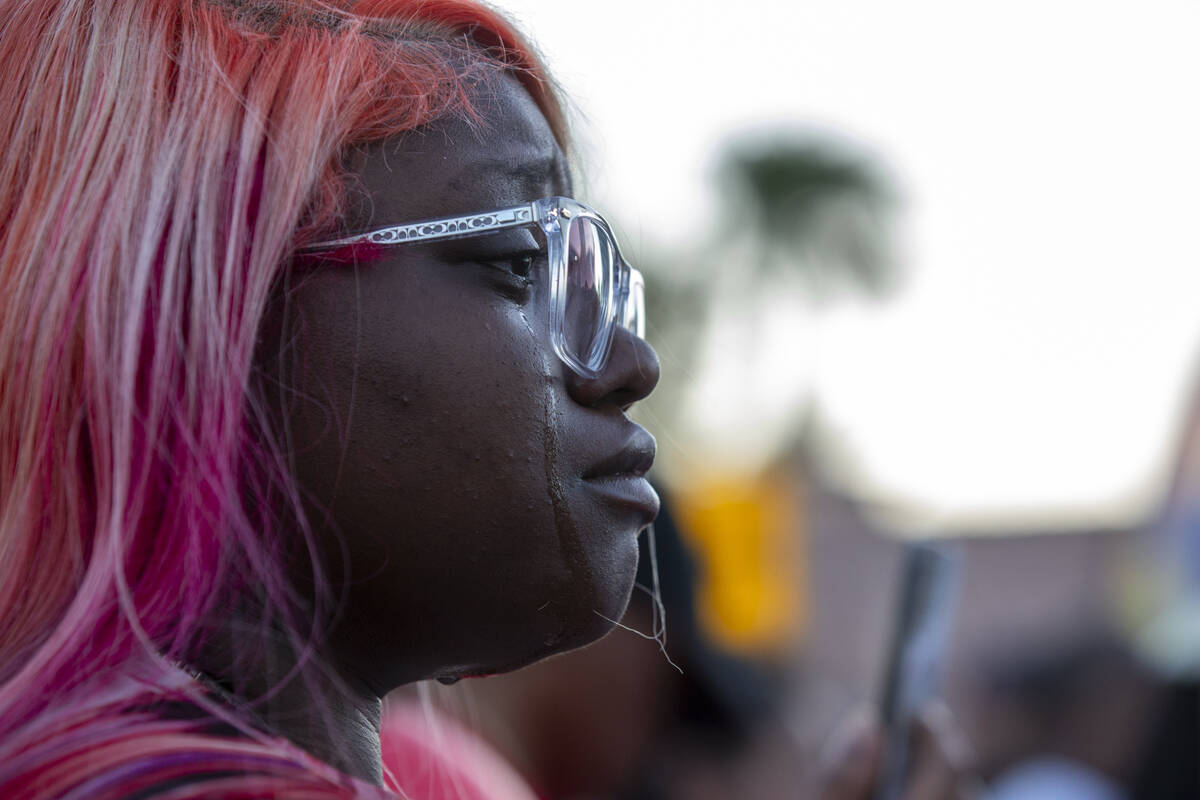 Mourners gather during a candlelight service for Kayla Harris at Craig Ranch Villas, Wednesday, ...