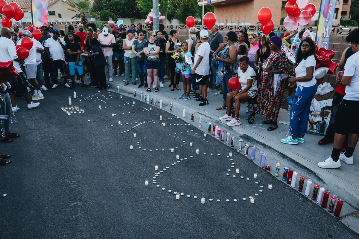 Mourners gather during a vigil for Kayla Harris, who was killed in a quintuple homicide on June ...