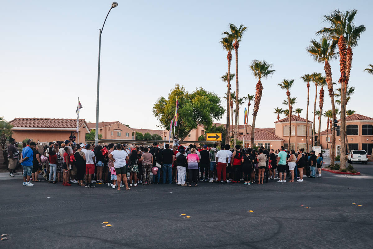 Mourners gather during a vigil for Kayla Harris, who was killed in a quintuple homicide on June ...