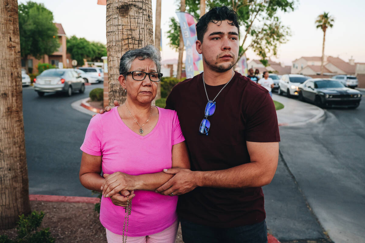 Mourners say a prayer during a vigil for Kayla Harris, who was killed in a quintuple homicide o ...