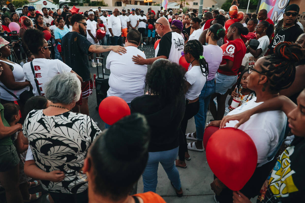Mourners gather during a vigil for Kayla Harris, who was killed in a quintuple homicide on June ...