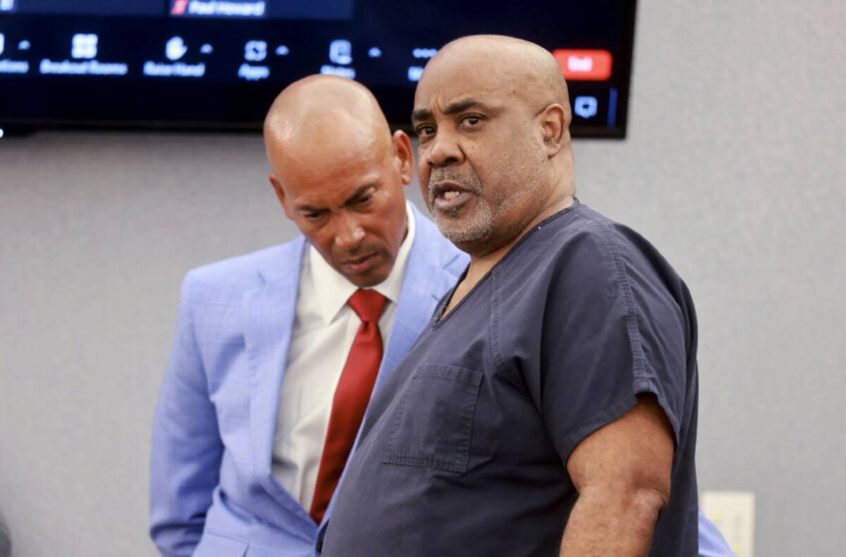 Duane "Keffe D" Davis, right, talks to his attorney, Carl Arnold, in court at the Regional Just ...