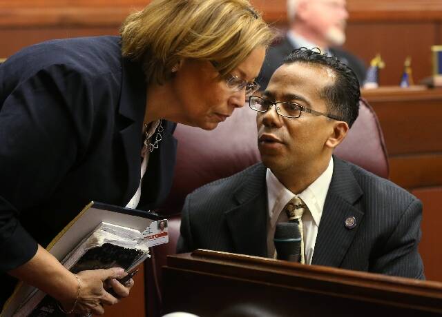 Nevada Assemblyman Steven Brooks, D-North Las Vegas, talks with attaché Robin Carter on the As ...