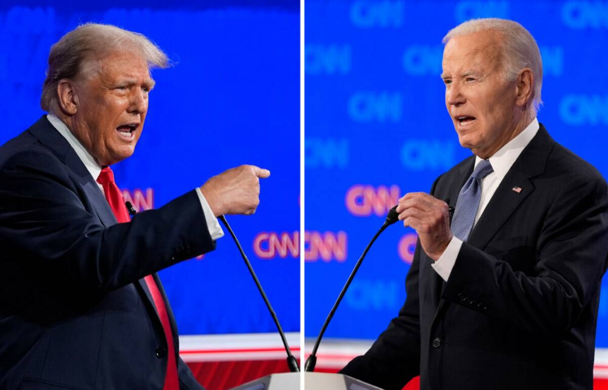 Donald Trump, left, and President Joe Biden talk during a presidential debate hosted by CNN, Th ...