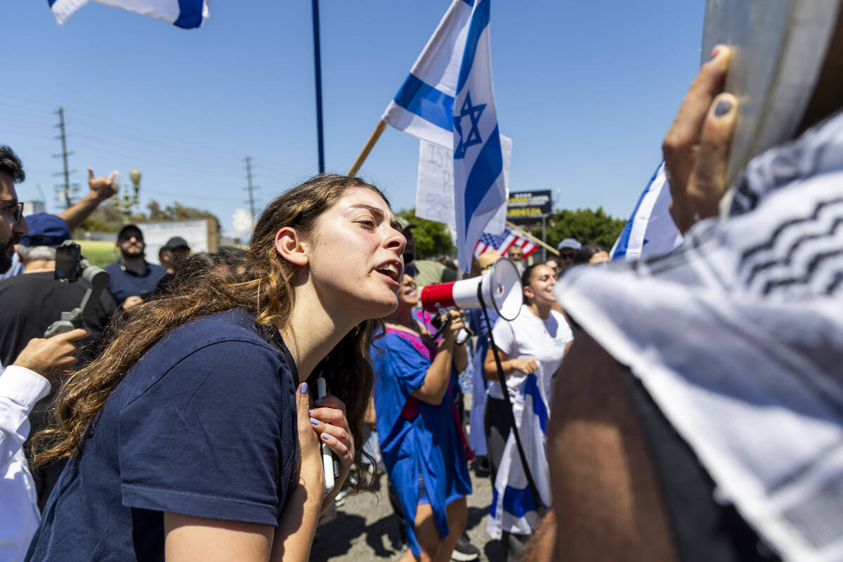 FILE - Pro-Israel and pro- Palestinian protesters argue opposing views near Adas Torah synagogu ...