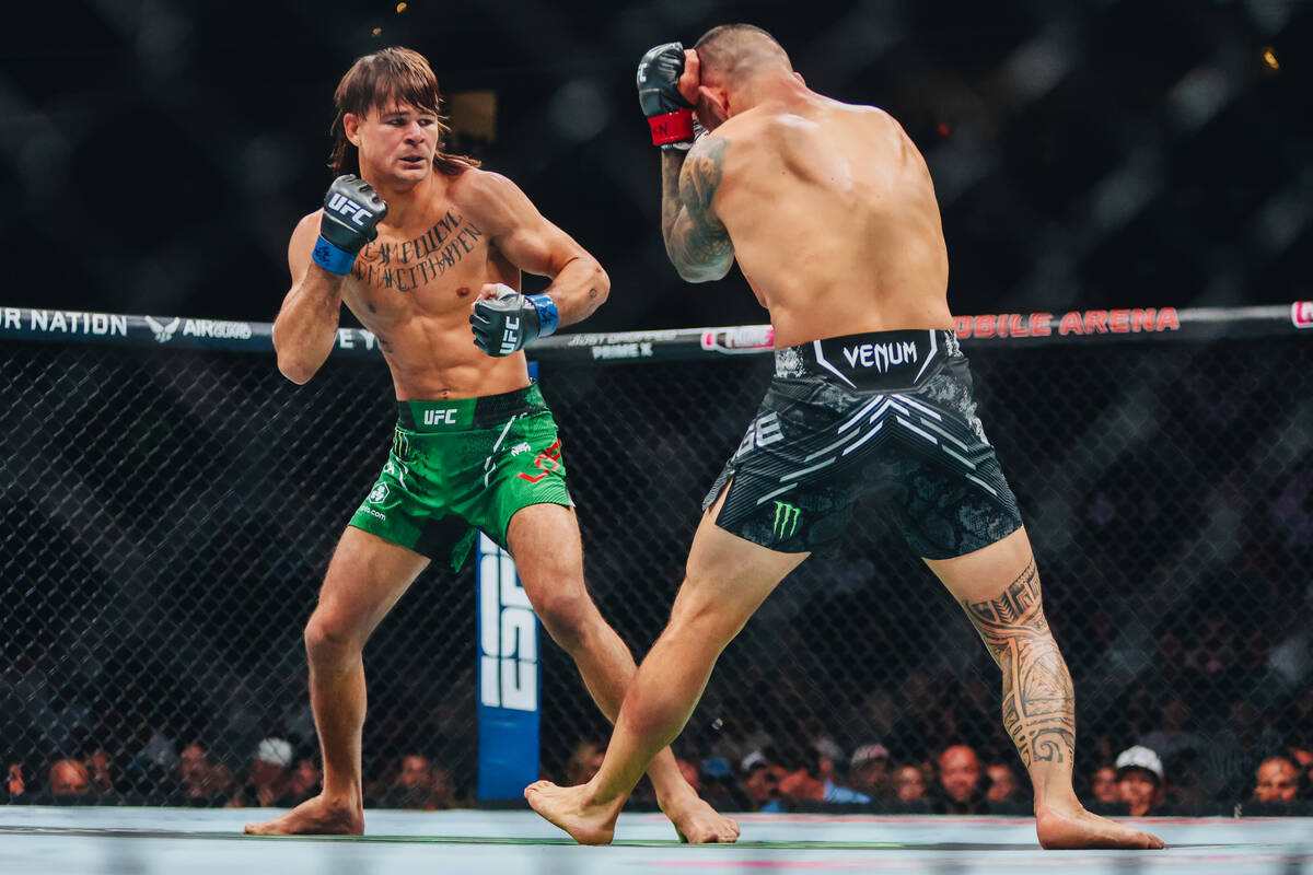Diego Lopes throws a punch at Dan Ige during their catchweight bout at UFC 303 at T-Mobile Aren ...