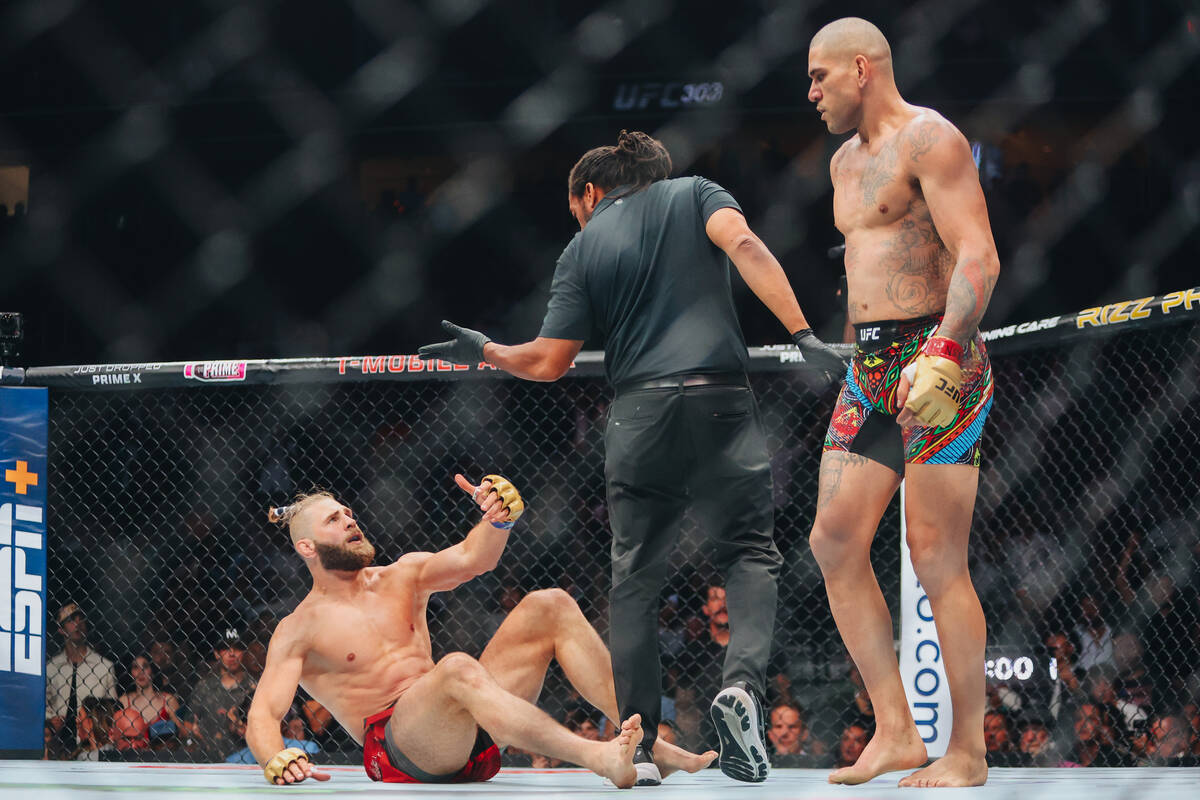 Jiri Prochazka gestures to the referee after being knocked to the mat by Alex Pereira during th ...