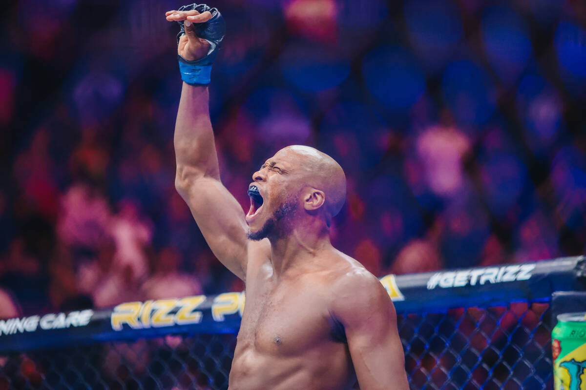 Michael Page yells as he enters the cage at the beginning of the welterweight bout at UFC 303 a ...