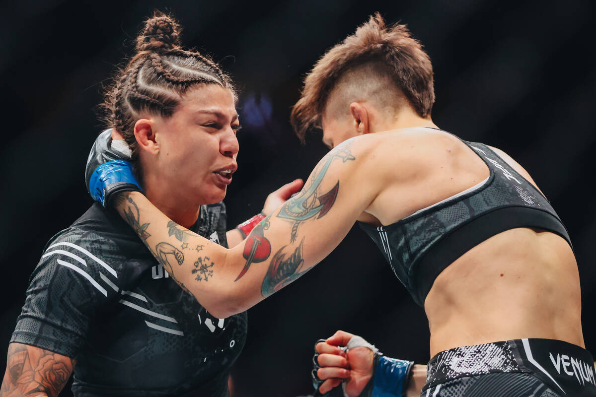 Mayra Bueno Silva, left, fights Macy Chiasson during the bantamweight bout at UFC 303 at T-Mobi ...