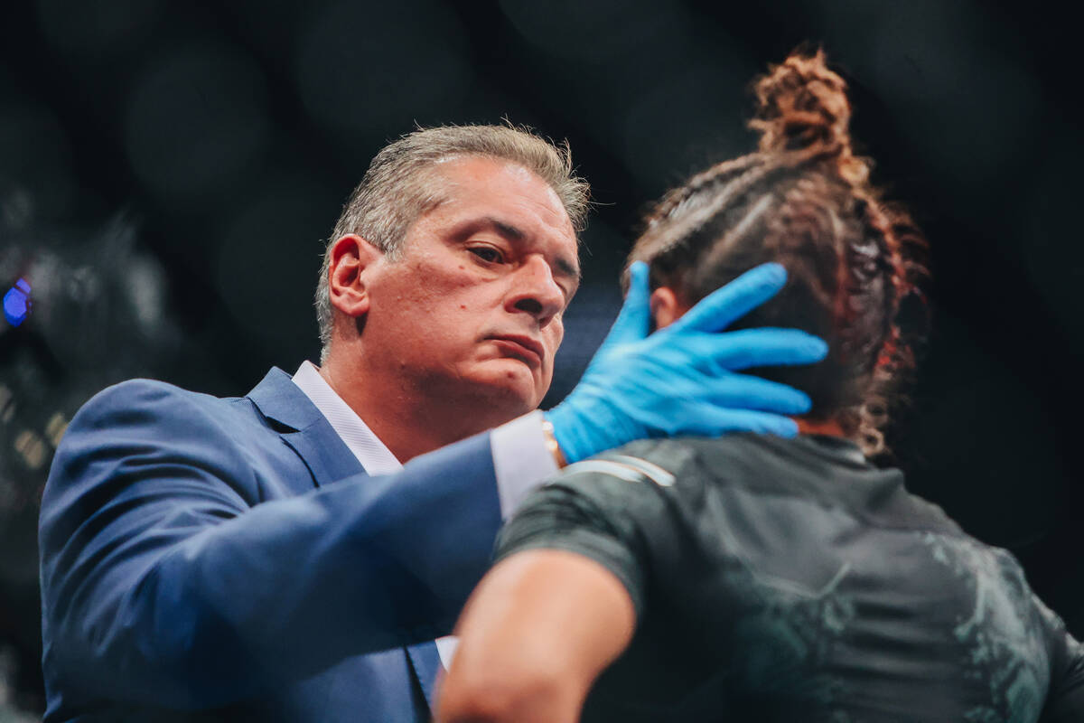 Mayra Bueno Silva is given a medical check during the bantamweight bout at UFC 303 at T-Mobile ...
