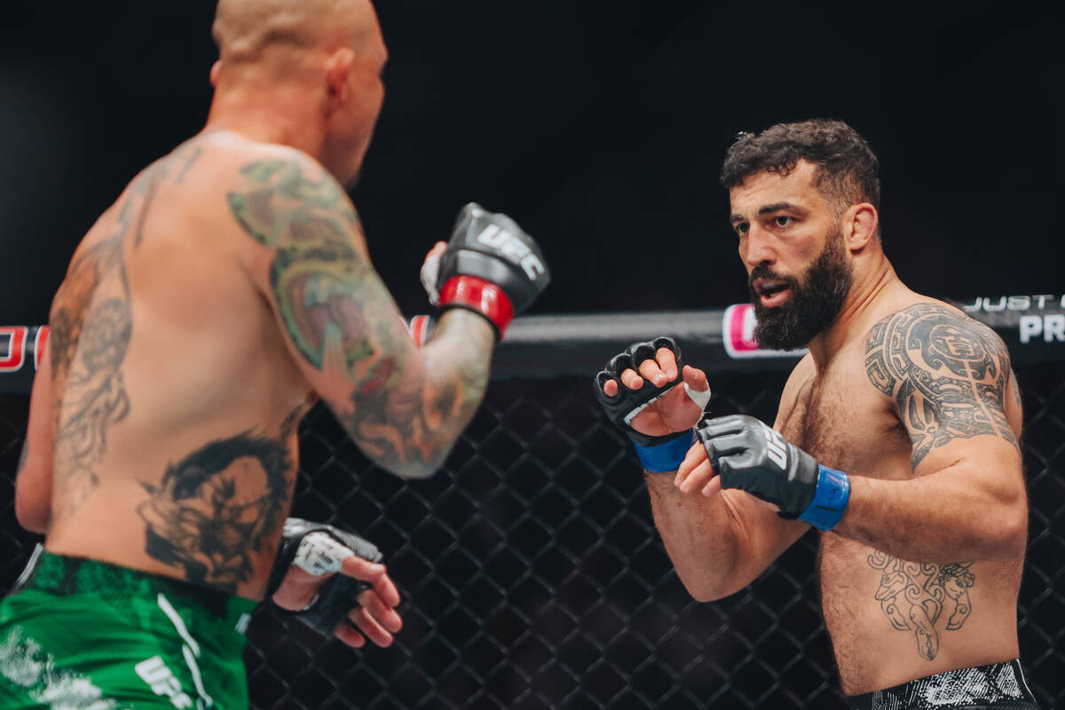 Roman Dolidze fights during the light heavyweight bout at UFC 303 at T-Mobile Arena on Saturday ...
