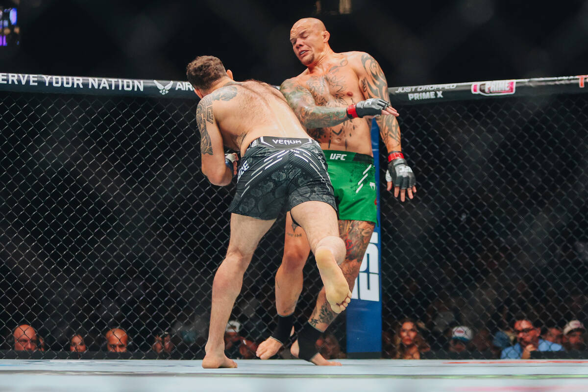 Anthony Smith, facing, fights Roman Dolidze during the light heavyweight bout at UFC 303 at T-M ...