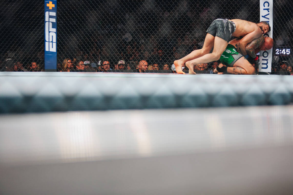 Anthony Smith fights Roman Dolidze during the light heavyweight bout at UFC 303 at T-Mobile Are ...