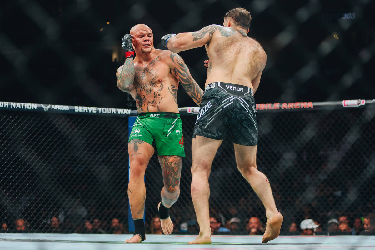 Anthony Smith, facing, fights Roman Dolidze during the light heavyweight bout at UFC 303 at T-M ...