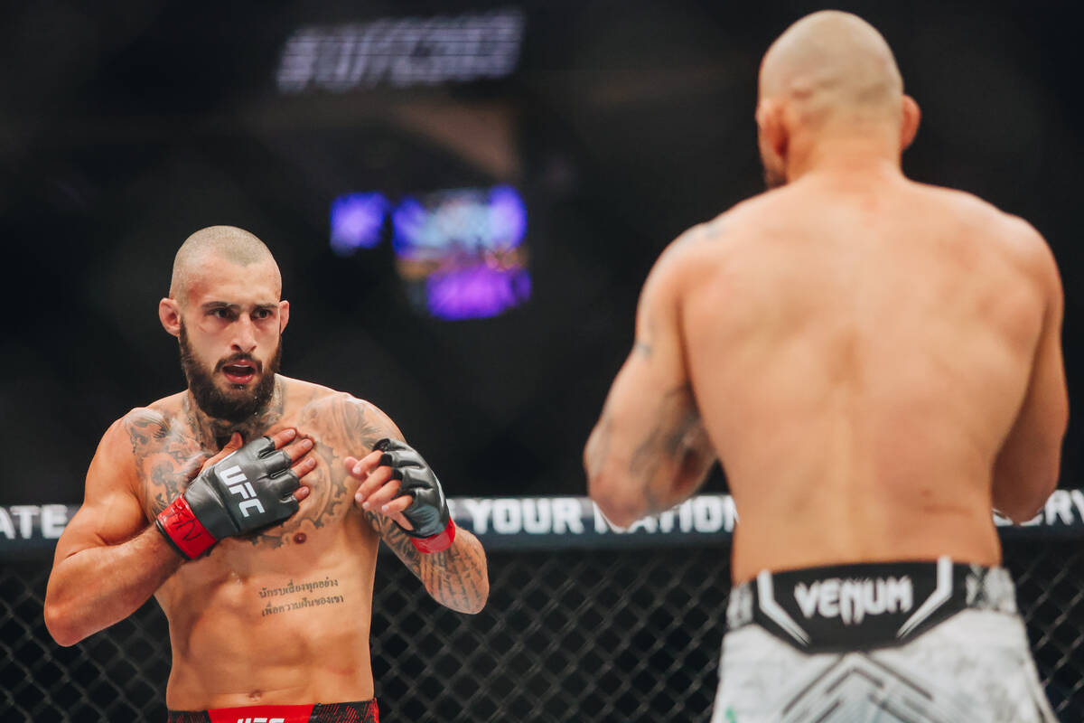 Charles Jourdain slaps his chest during a featherweight bout against Jean Silva at UFC 303 at T ...