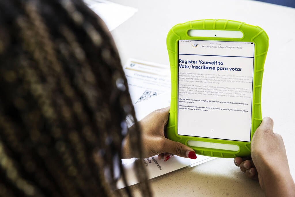 Pre-registering to vote during a vote drive as part of National Voter Registration Day on Tuesd ...